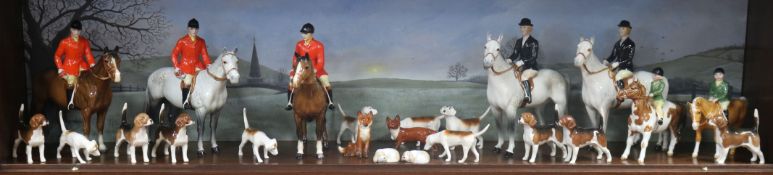 A Beswick Fox hunting group, comprising two Huntswoman 1730 on grey horses, three Huntsman 1501, two