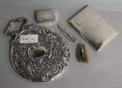 An Edwardian repousse silver hand mirror, a silver box, buffer, fruit knife and cigarette case.
