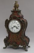 A 19th century buhl mantel clock, ormolu-mounted and having white enamelled dial with Roman and