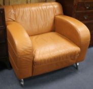 A tan leather armchair