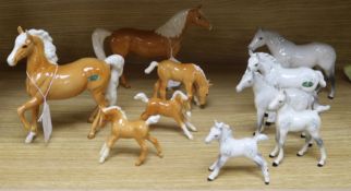 A collection Beswick grey and palomino horses and foals