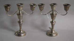 A pair of silver dwarf candelabra, A.L. Davenport Ltd, Birmingham, 1959, height 16.6cm.