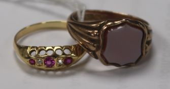 A late Victorian 9ct and carnelian set signet ring and an Edwardian 18ct gold and gem set ring.