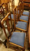 A set of six Queen Anne style walnut dining chairs