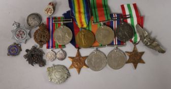 A collection of WWI / WWII medals and US Air Force gunner's badge