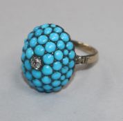 A 19th century yellow metal, turquoise and diamond set domed top ring, size J.
