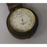 A pocket barometer, leather cased