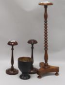 Three wig stands and a goblet tallest 53cm