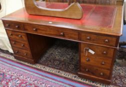 An Edwardian mahogany partner's desk W.152cm