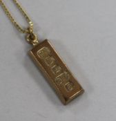 A 9ct gold ingot pendant, on a gilt metal chain, pendant 27mm.