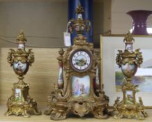 A gilt metal and porcelain mounted clock garniture height 54cm