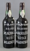 Two bottles of D'Oliveiras Reserva Malvazia Madeira, 1895.