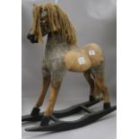 A small wooden rocking horse 61cm