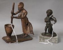 An African wood fired bronze and a bronze cherub