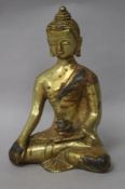 A Chinese gilt bronze figure of Buddha