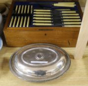 An oak cased canteen of plated flatware and an entree dish and cover