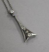 A white metal and diamond set arrowhead shaped pendant, on a fine link chain, pendant 25mm.
