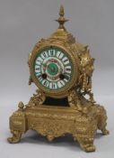 A brass decorative faced clock height 26cm