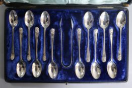 A cased set of twelve Victorian silver Old English silver teaspoons, London, 1882 and a pair of