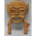 A Tanzania tribal mask, with old label for Universities Mission to Central Africa