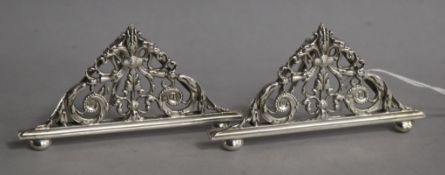 A pair of late Victorian pierced silver menu holders, William Hutton & Sons, London, 1896, width