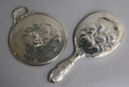 Two early 20th century repousse silver "Reynold's Angels" hand mirrors by William Comyns.