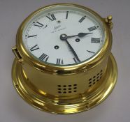 A Schatz 'Royal Mariner' brass ship's bulkhead clock, the two-train eight-day movement having