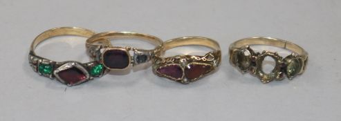 Four Georgian yellow and white metal rings, variously-set with gems and seed pearls in carved