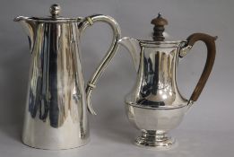 A late Victorian silver hot water pot and a later silver hot water pot, gross 27.5 oz.