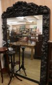 A Victorian heavily carved and painted oak overmantel W.150cm
