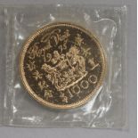 A Hong Kong 'Royal Visit' 22ct gold $1000 commemorative coin, in sealed plastic pack and