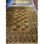 A Bokhara rust ground rug and a large carpet 280x170cm + 195 x 106cm