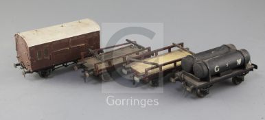 A GW fuel tanker wagon, no.5, a horse box, in brown, an LMS flat wagon, no.46218 and an NE flat