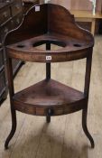 A Regency mahogany and ebony line inlaid bowfront corner washstand W.72cm