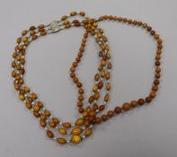 Two amber bead necklaces.