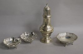 A silver sugar caster, a pair of pierced silver bon bon dishes and another pierced silver dish, (4),