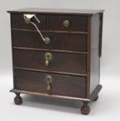 An early 18th century miniature oak chest W.26cm. H 28.5cm