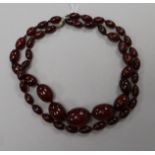 Two simulated cherry amber necklaces.