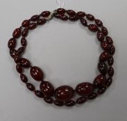 Two simulated cherry amber necklaces.