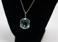 A yellow metal fancy cut aquamarine and diamond set drop pendant, on a yellow metal chain,