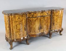 A pair of Italian walnut sideboards, with veined black marble inset tops, W.6ft 10in. D.2ft 2in. H.