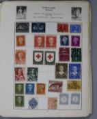 A Cardinal All World stamp album including commonwealth issues and an album of F.D.C's and loose
