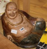 A Chinese painted wood figure of Budha and a scroll H.30cm.