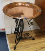 A copper dish on wrought iron stand W.56cm.