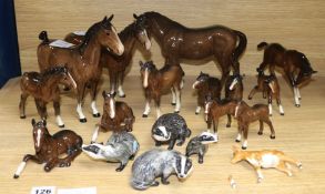 A collection of Beswick horses and badgers