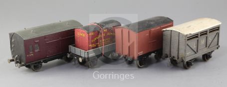 A cattle wagon, no.46219, in grey, a flat truck, no.M260113, in grey with LMS container, a horse
