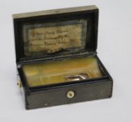 A 19th century bois durci musical snuff box