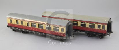A pair of BR 1st class coaches, no's.9272 (Bassett Lowke) and 26233, in blood and custard