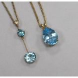 A 9ct gold and blue topaz pendant, on 9ct gold chain and a yellow metal and blue zircon drop pendant