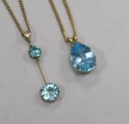 A 9ct gold and blue topaz pendant, on 9ct gold chain and a yellow metal and blue zircon drop pendant